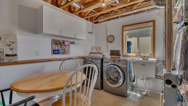 2647 Olive Ln, Sauk Rapids, MN 56379 - washroom with cabinet space and washer and clothes dryer