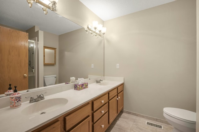 10708 Sycamore St NW, Coon Rapids, MN 55433 - bathroom with toilet, double vanity, a shower with door, and baseboards