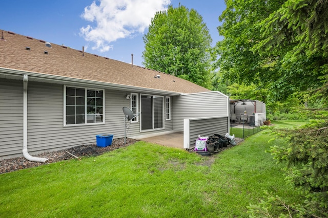 10708 Sycamore St NW, Coon Rapids, MN 55433 - back of house featuring a patio, a yard, and a shingled roof