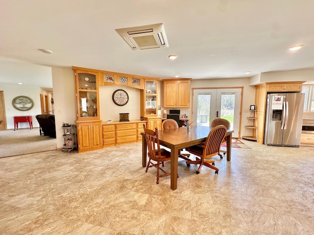 dining space with recessed lighting
