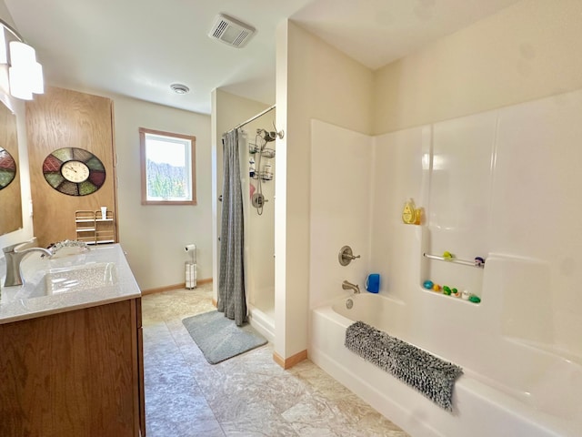 bathroom with vanity, shower / tub combo with curtain, and baseboards