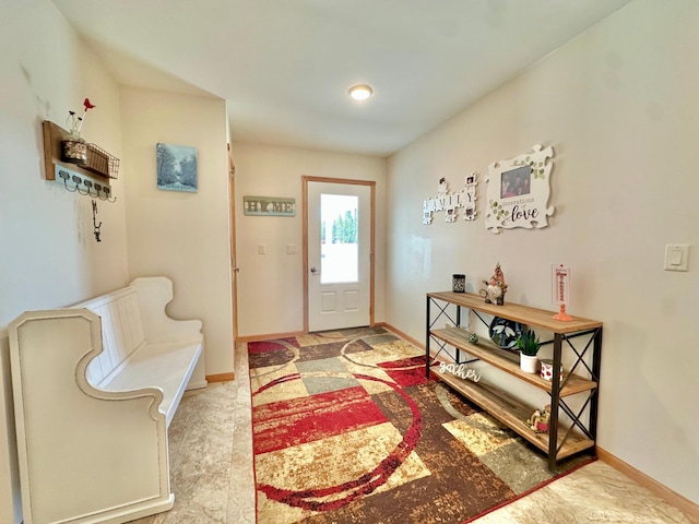 entryway featuring baseboards