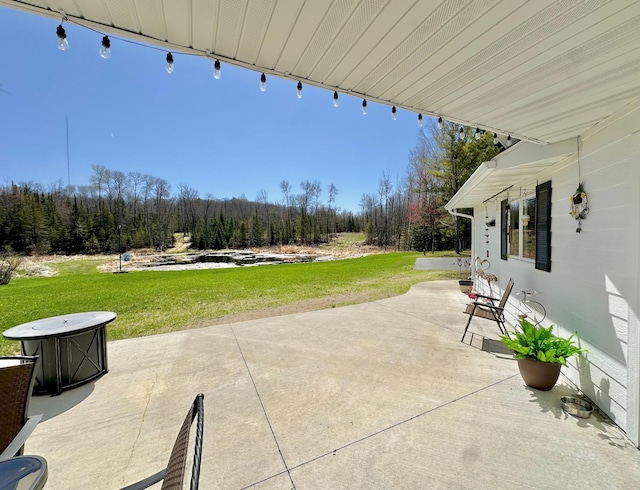 view of patio featuring a view of trees