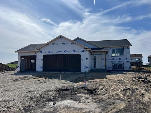 property in mid-construction with a garage
