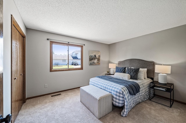 11123 Drake St NW, Coon Rapids, MN 55433 - carpeted bedroom featuring a textured ceiling and baseboards