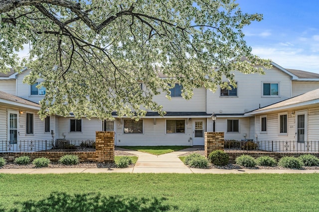 11123 Drake St NW, Coon Rapids, MN 55433 - townhome / multi-family property with a front lawn, central AC, and a patio