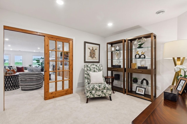 living area featuring recessed lighting, carpet, and french doors
