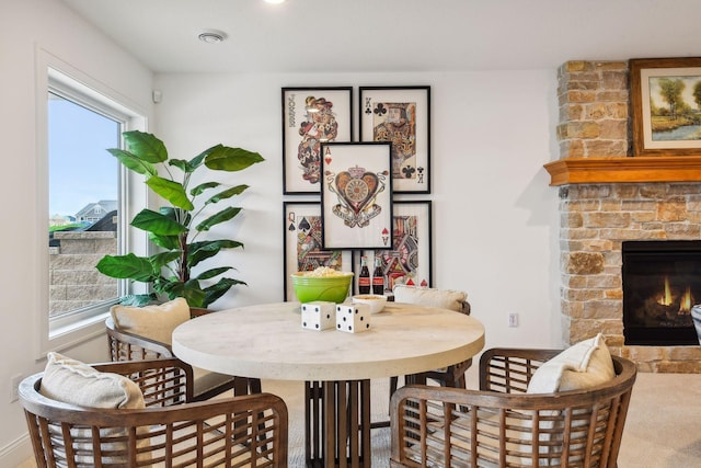 dining area featuring a large fireplace