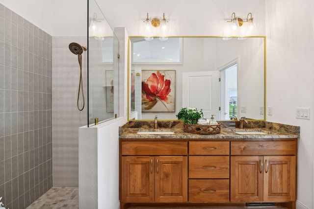 bathroom featuring walk in shower and double vanity