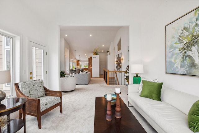 living area featuring carpet floors and recessed lighting