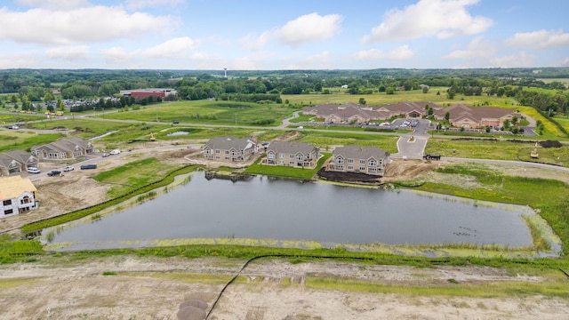 aerial view of residential area with a large body of water