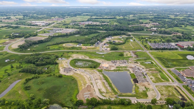aerial view of property and surrounding area with a large body of water
