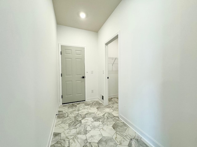 7499 Odell Ave NE, Otsego, MN 55330 - corridor featuring light marble finish flooring, baseboards, and recessed lighting