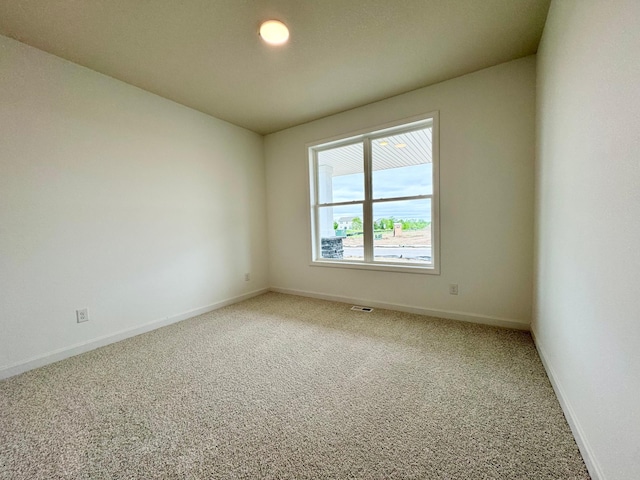 7499 Odell Ave NE, Otsego, MN 55330 - unfurnished room featuring light carpet and baseboards