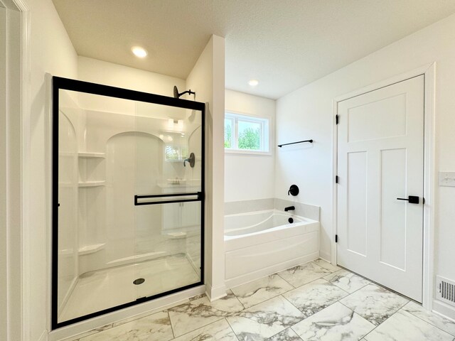 7499 Odell Ave NE, Otsego, MN 55330 - full bath with marble look tile flooring, a stall shower, a bath, baseboards, and recessed lighting