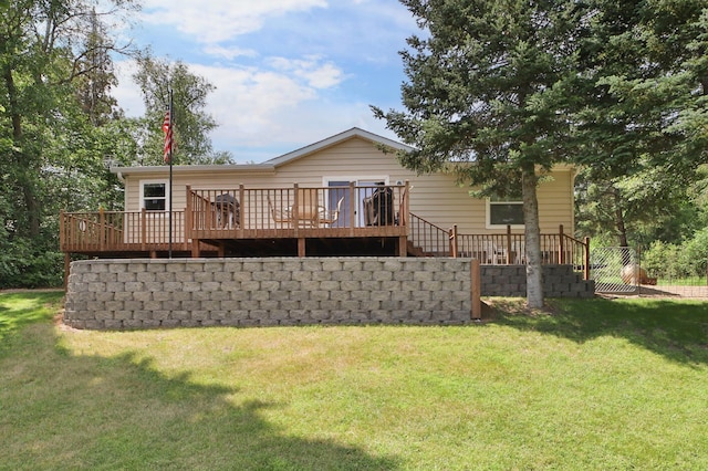 back of property featuring a wooden deck, a lawn, and stairway