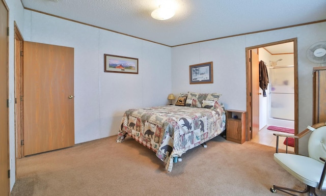 carpeted bedroom with ornamental molding and a textured ceiling