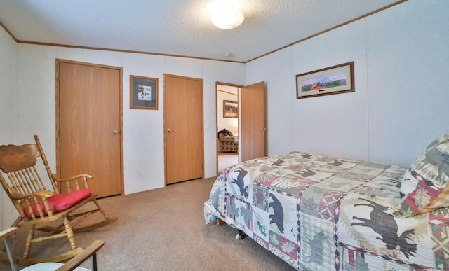 bedroom with carpet, crown molding, and a textured ceiling