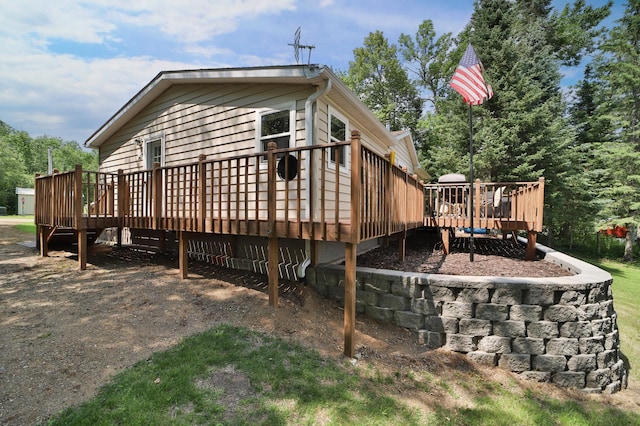 view of property exterior with a deck