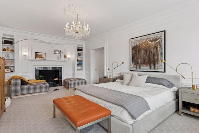 510 Groveland Ave Unit 304, Minneapolis, MN 55403 - bedroom featuring crown molding, a chandelier, carpet flooring, and a fireplace