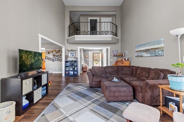 27088 130th St, Thomastown Twp, MN 56479 - living room with wood finished floors, a towering ceiling, and baseboards
