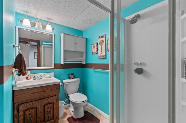 27088 130th St, Thomastown Twp, MN 56479 - full bath with a stall shower, a paneled ceiling, vanity, toilet, and tile patterned floors