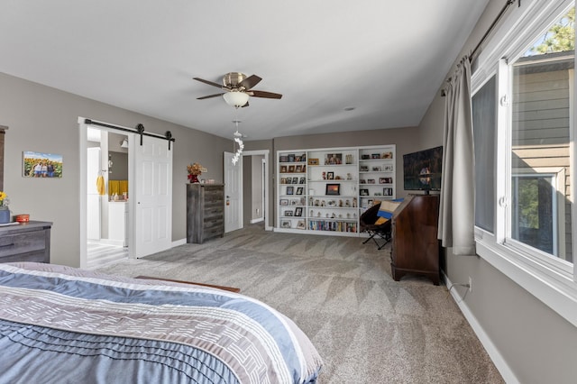 27088 130th St, Thomastown Twp, MN 56479 - carpeted bedroom featuring baseboards, a barn door, and a ceiling fan