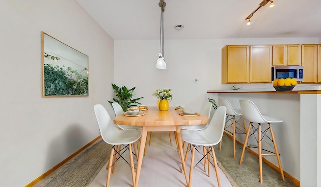 dining room with baseboards