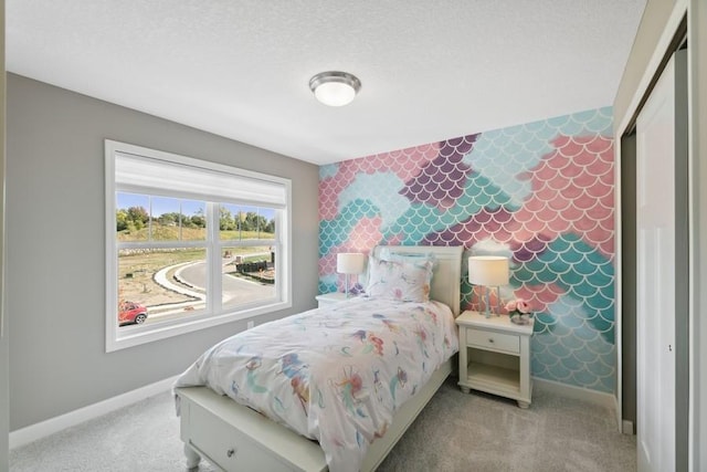 bedroom featuring light carpet and baseboards