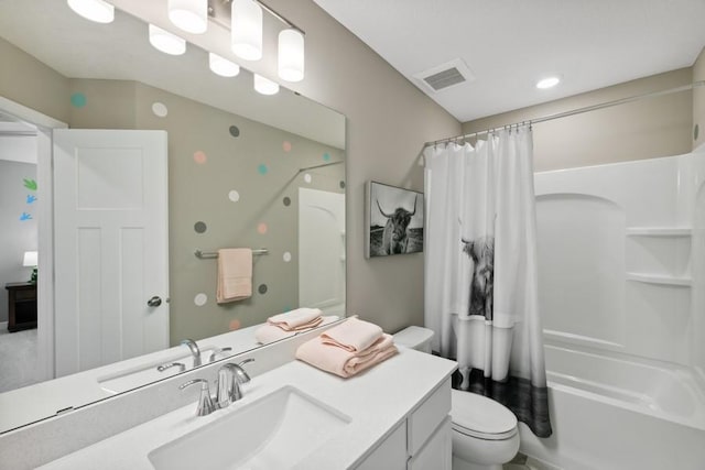 full bathroom with toilet, shower / bath combo with shower curtain, and vanity