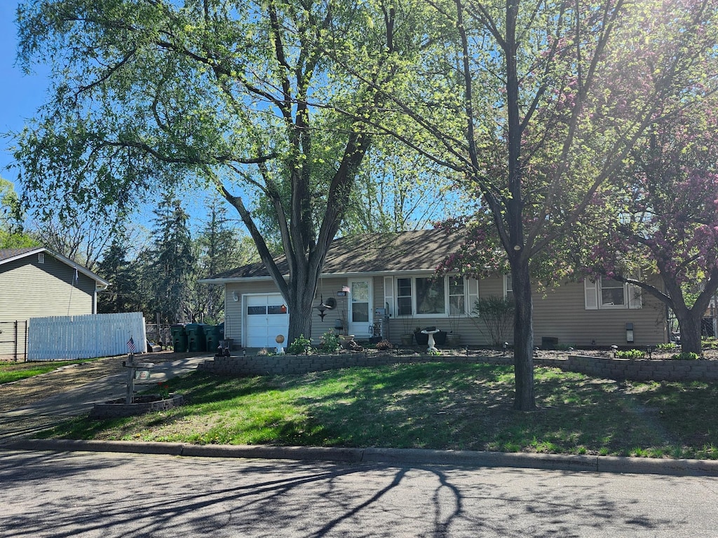 view of front of property with driveway and an attached garage