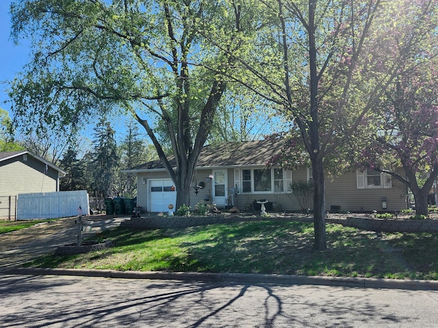 view of front of property with driveway and an attached garage