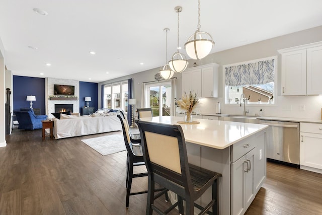 13404 Avila Ave, Rosemount, MN 55068 - kitchen with dishwasher, a sink, plenty of natural light, a kitchen island, and recessed lighting