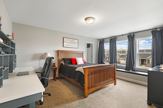 13404 Avila Ave, Rosemount, MN 55068 - bedroom with light carpet, a desk, baseboards, and a textured ceiling