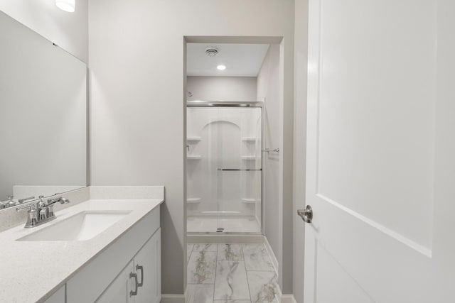 13404 Avila Ave, Rosemount, MN 55068 - full bathroom featuring marble finish floors, vanity, a stall shower, and baseboards