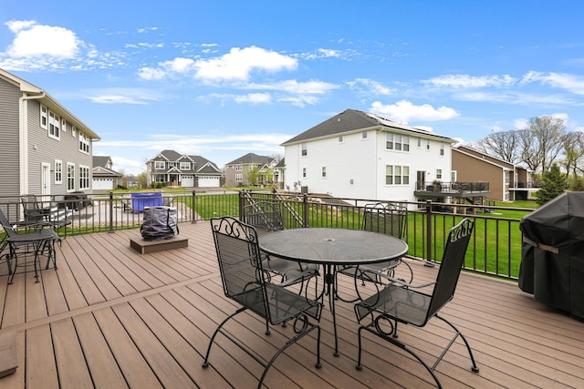 13404 Avila Ave, Rosemount, MN 55068 - deck with a residential view, outdoor dining area, grilling area, and a lawn
