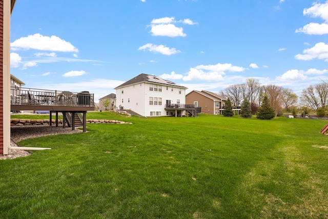 13404 Avila Ave, Rosemount, MN 55068 - view of green lawn with stairs and a wooden deck