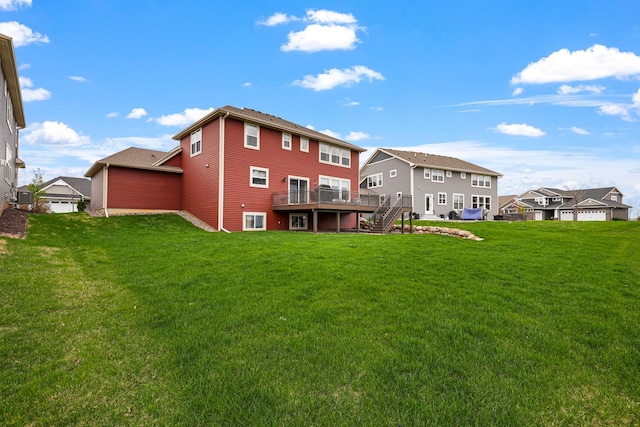 13404 Avila Ave, Rosemount, MN 55068 - back of house featuring stairs, a wooden deck, and a lawn