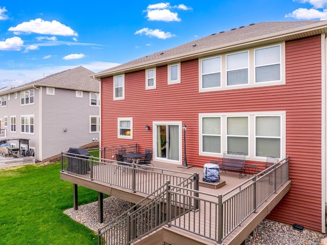 13404 Avila Ave, Rosemount, MN 55068 - back of property featuring a deck and a lawn