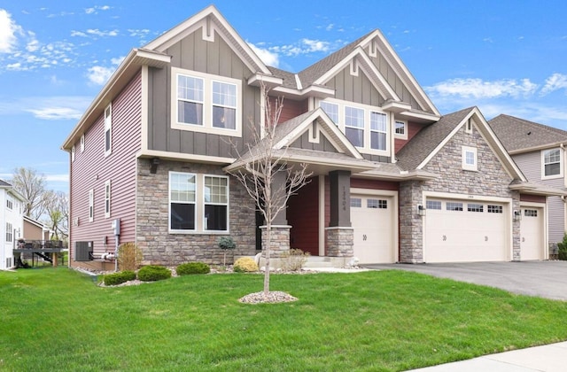 13404 Avila Ave, Rosemount, MN 55068 - craftsman house featuring board and batten siding, stone siding, a garage, a front lawn, and asphalt driveway
