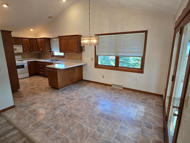 735 10th Ave S, Waite Park, MN 56387 - kitchen featuring white appliances, a sink, a peninsula, light countertops, and baseboards