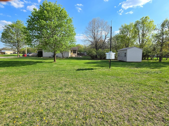 735 10th Ave S, Waite Park, MN 56387 - view of grassy yard with an outbuilding