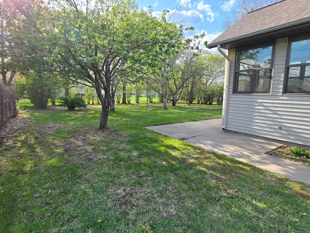 735 10th Ave S, Waite Park, MN 56387 - view of grassy yard featuring a patio area