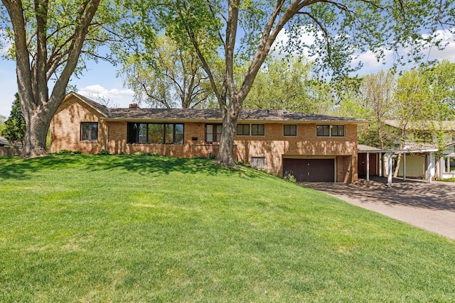 5212 Colonial Dr, Golden Valley, MN 55416 - view of front of house featuring brick siding, concrete driveway, a garage, a front yard, and a chimney