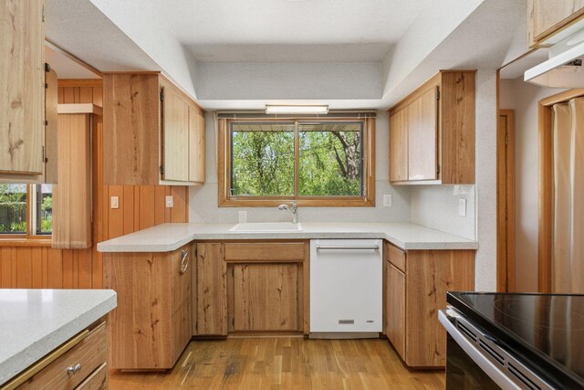 5212 Colonial Dr, Golden Valley, MN 55416 - kitchen with dishwasher, a sink, light wood-type flooring, light countertops, and stainless steel range with electric stovetop
