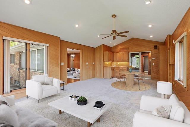 5212 Colonial Dr, Golden Valley, MN 55416 - living room with wood walls, lofted ceiling, a ceiling fan, and light carpet
