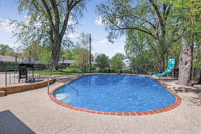 5212 Colonial Dr, Golden Valley, MN 55416 - view of swimming pool with a water slide and a patio area