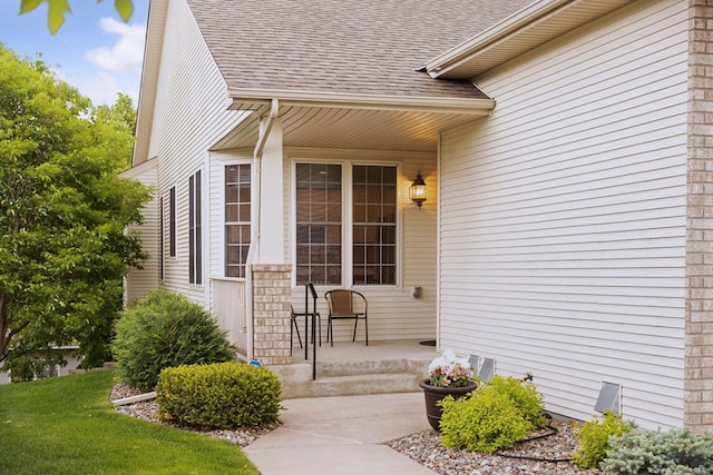 17462 Haralson Dr, Eden Prairie, MN 55347 - doorway to property with a shingled roof and a porch