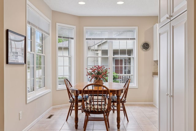 17462 Haralson Dr, Eden Prairie, MN 55347 - dining area featuring light tile patterned flooring and recessed lighting