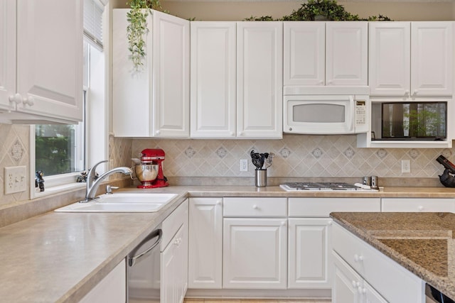 17462 Haralson Dr, Eden Prairie, MN 55347 - kitchen featuring white appliances, white cabinets, and decorative backsplash